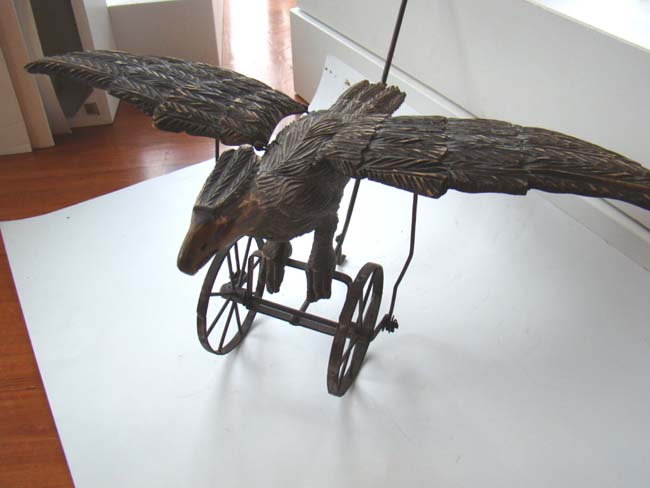 A late Victorian carved wooden spread wing eagle push toy — image 6